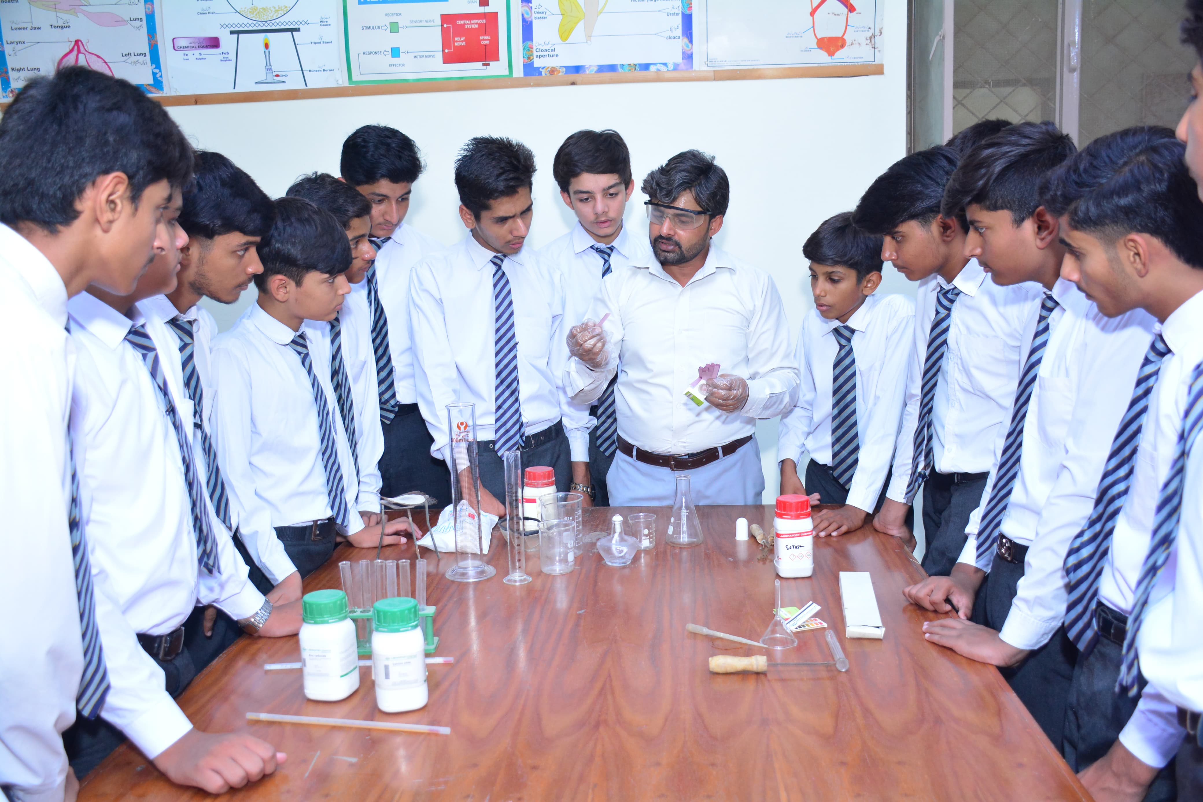 Young students writing in classroom